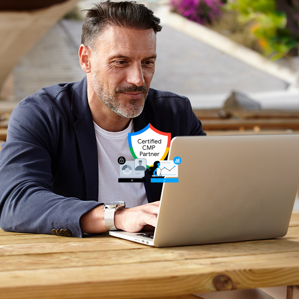 Imagen de un hombre frente a un ordenador y un icono de seguridad con los colores de Google
