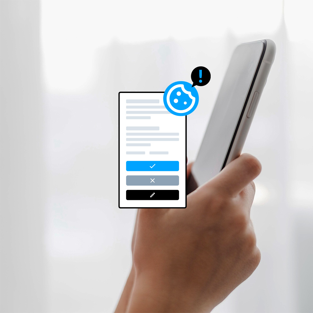 Imagen de unas manos sosteniendo un smartphone y una ilustración de un banner de cookies conforme a la ley