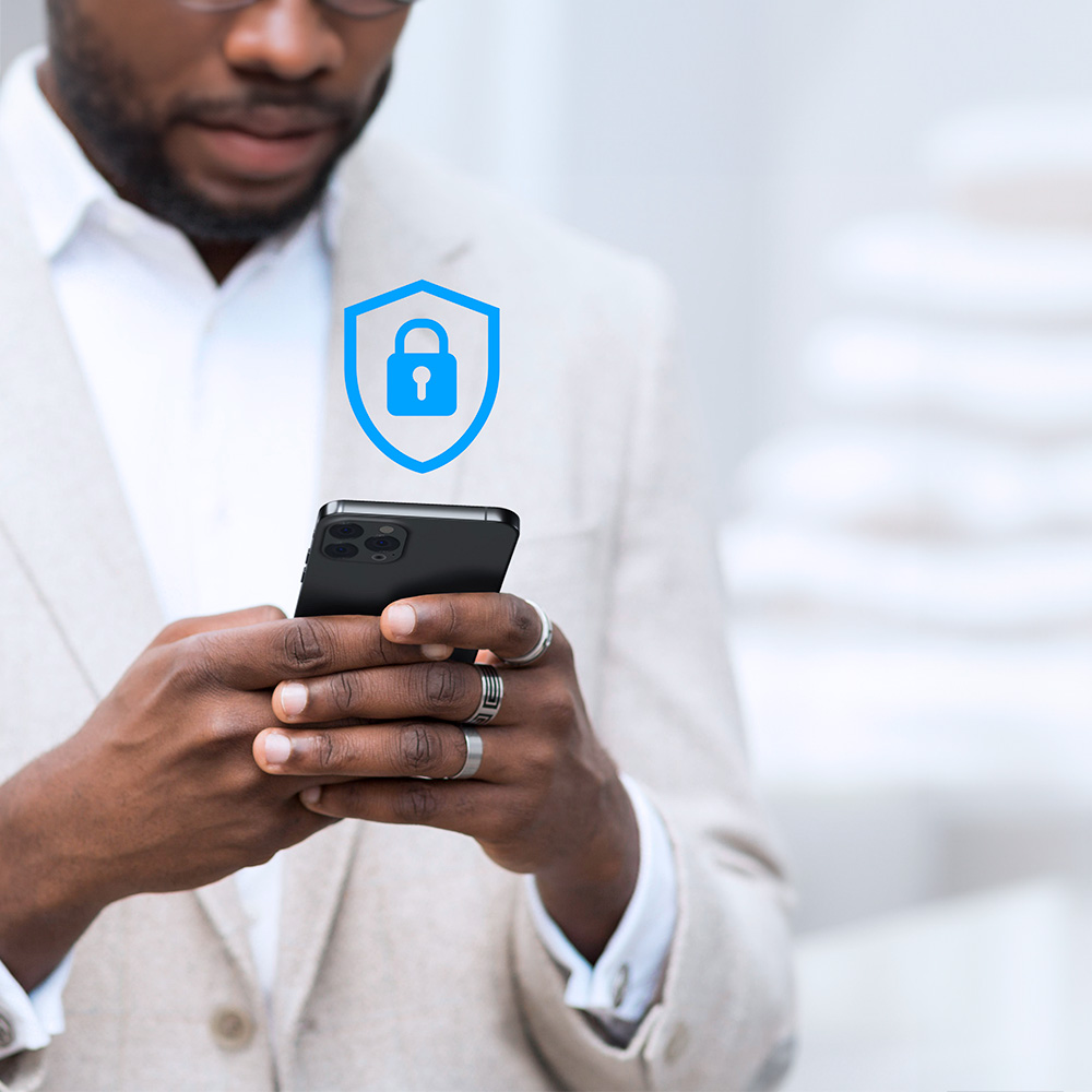 Man holding phone with shield and lock