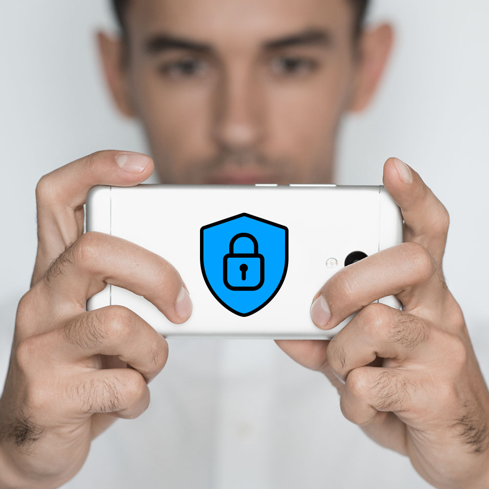 Image of a guy playing with his smartphone
